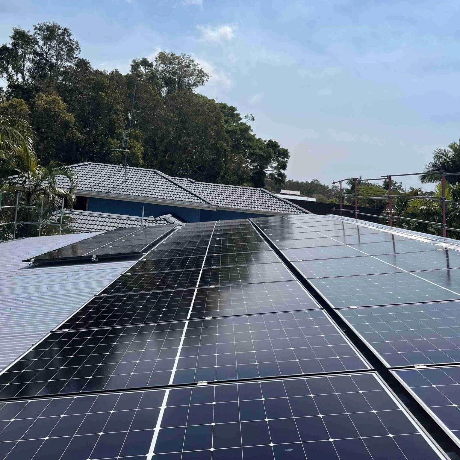 Tesla Electrical solar technician commissioning a rooftop solar system on the Northern Rivers